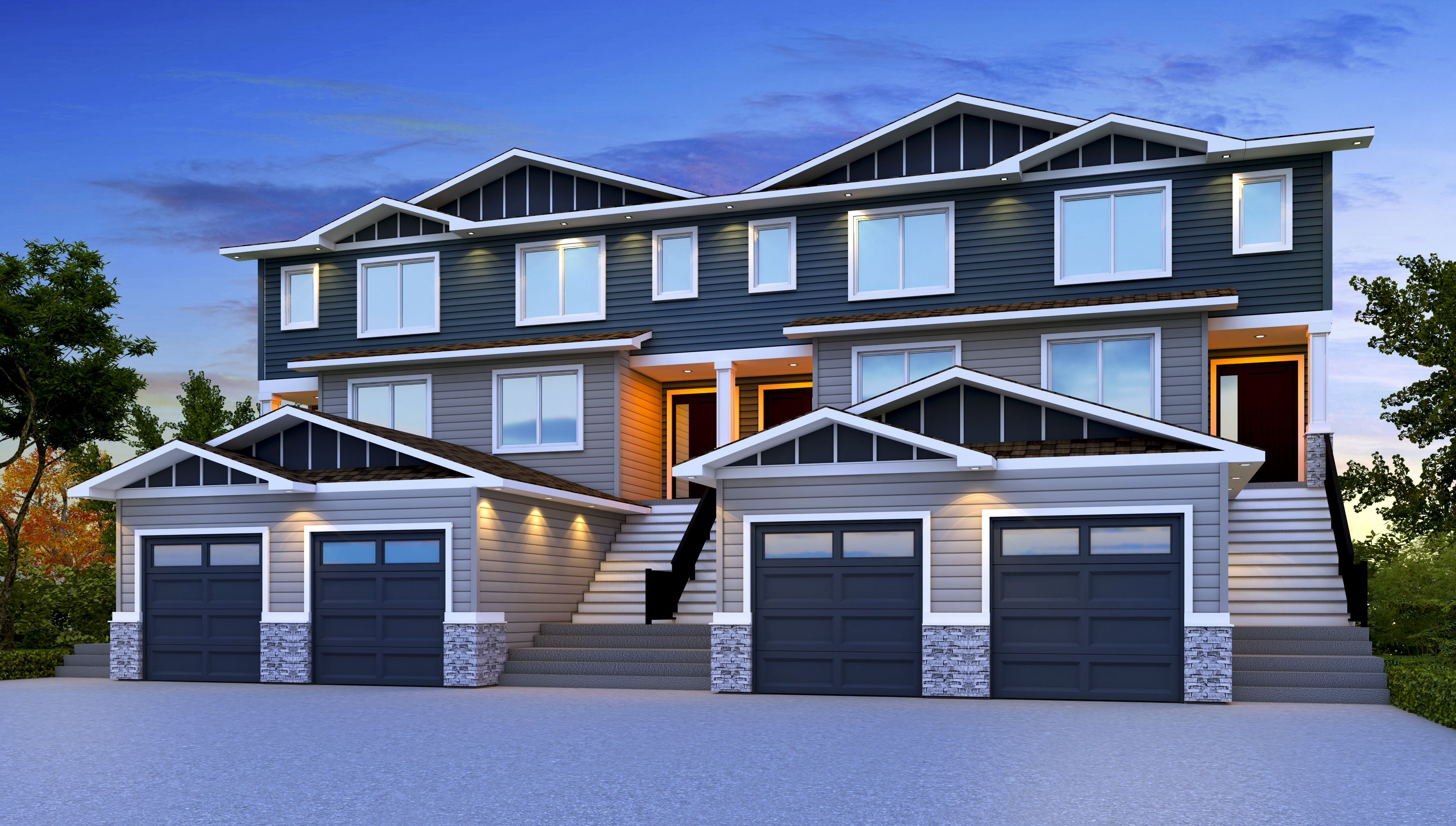 The Devine townhomes at dusk, lit entries along Heritage Circle.